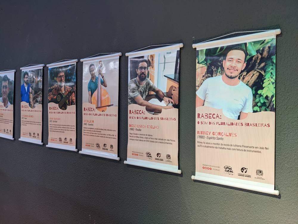 The exhibition's portrait banners: Ritney Gonçalves, Diego Lisboa Coelho, Adenilson, Adam Bahram