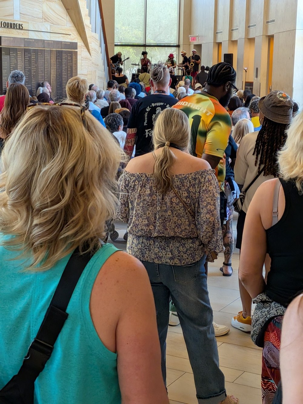 A packed crowd in North El Rio at the Musical Instrument Museum watching a reggae band perform on a Signature Event day